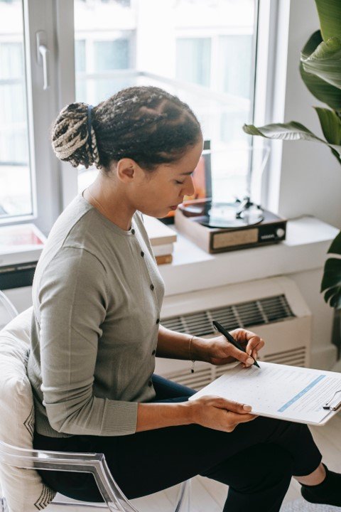Women writing on notepad