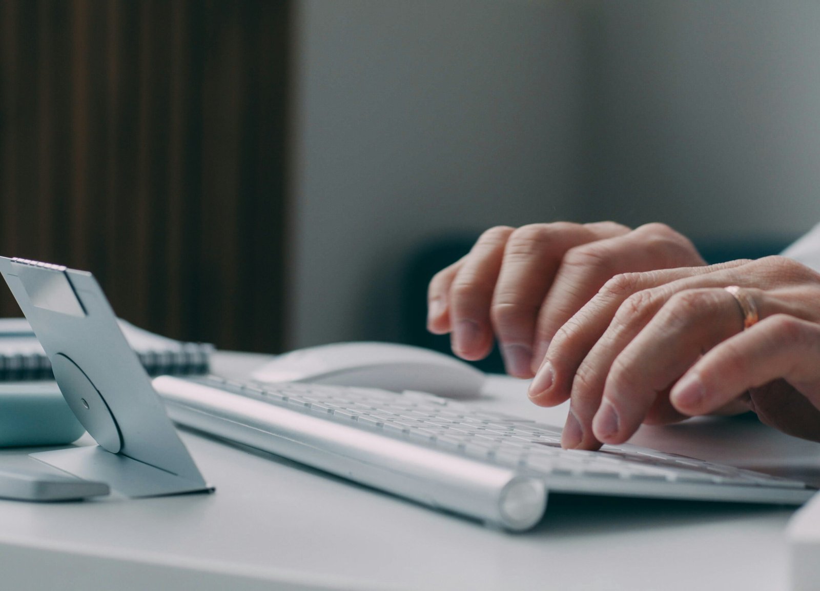 Person typing on keyboard